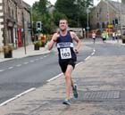Steve Rankin (Sunderland Strollers) leads through the streets of Prudhoe on his way to winning the Prudhoe Miners Race.